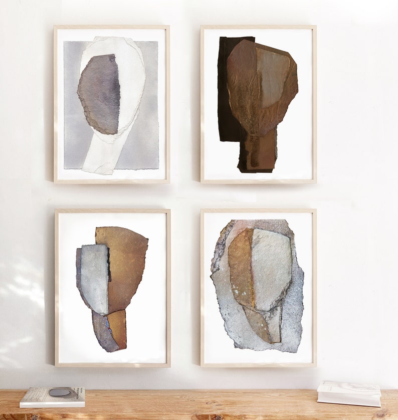 A set of four Giclee art prints of abstract portraits in warm neutral colors- beige to golden brown, dove gray, brushed off-white, with black and bluish accents. The torn paper has rocky, grainy texture and rough edges, all hand signed at the bottom.