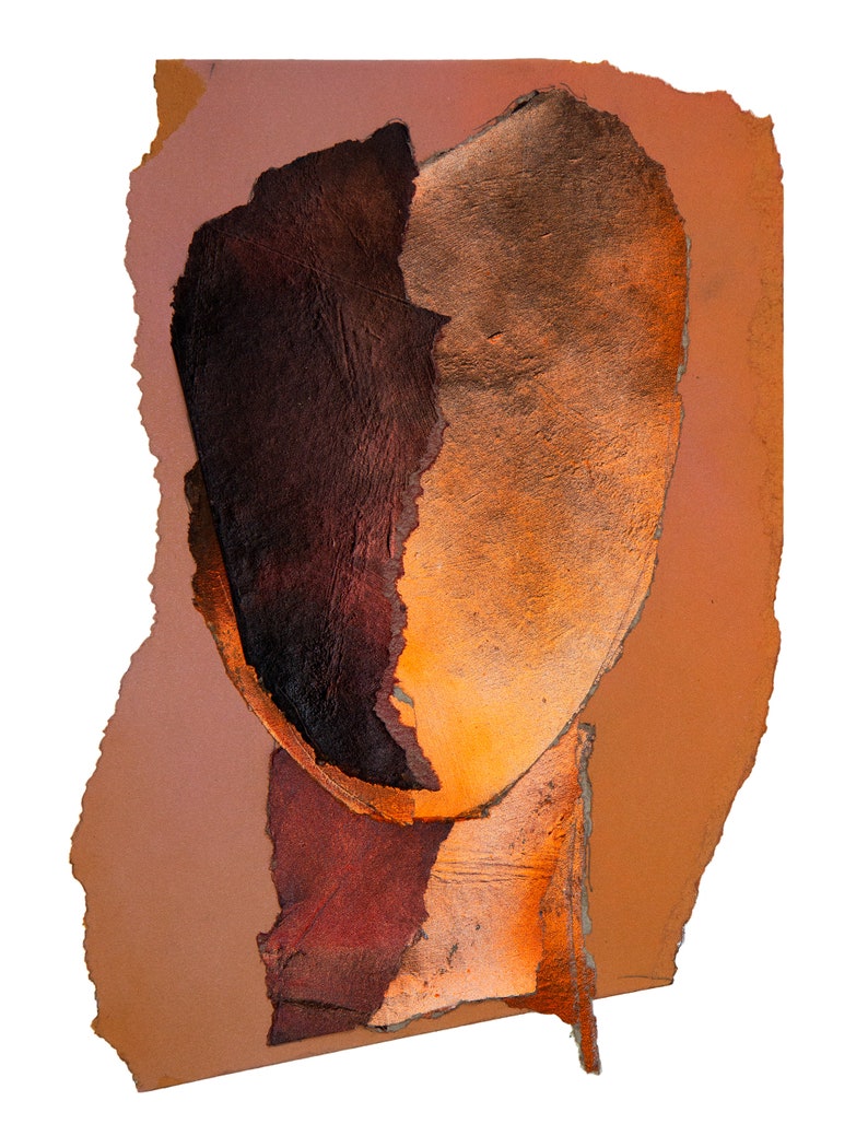 This dramatic, vivid brown-orange wall art print of an original painting shows an abstract head in all shades, varying from dark wood to blazing orange. A reddish accent drop spills out from the torn paper, random-shaped faded persimmon background.