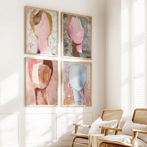 May include: Four abstract art prints in wooden frames, each featuring a different color palette and design. The prints are arranged in a grid pattern on a white wall.