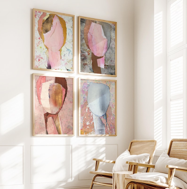May include: Four abstract art prints in wooden frames, each featuring a different color palette and design. The prints are arranged in a grid pattern on a white wall.