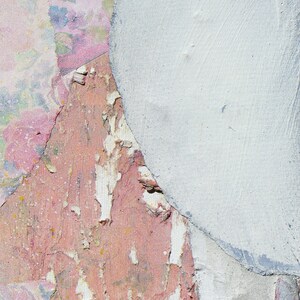 A detail of a high quality archival art print on Hahnemulle silky paper of a tender female abstract portrait in pastel tones of salmon and off white on a floral background with violet and orange. It is made of torn paper pieces, rich in texture.