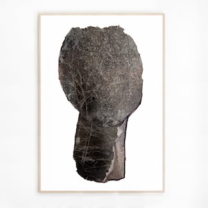 A modern high quality art print of an abstract head in shades of graphite grey with silver spray painted accents. The torn paper layers have rocky texture, webbed with light grey and white to create light and rough torn edges, outlined with charcoal.