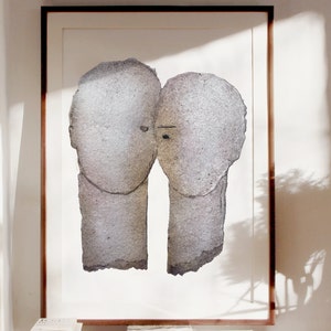 Wall decor with a framed high quality art print of a romantic abstract portrait of a love couple in shades of grey with silver finish on white. The two heads are composed of torn rough paper layers with exposed grungy edges and two eyes for accent.