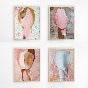 May include: Four framed abstract art prints with a pink, brown, and gray color scheme. Each print features a unique collage of textured paper and paint.