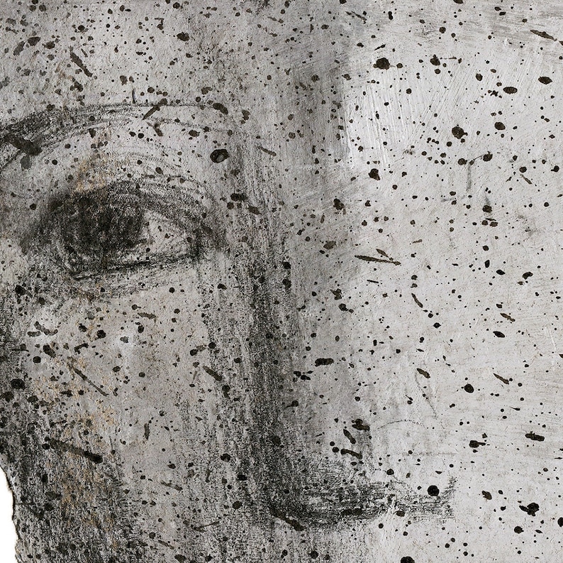 A detail of high quality art print of a modern abstract portrait in shades of gray.  The facial features are graphite sketched and have black paint drops accents. The texture is of an eraser brushed paper and thick paper.