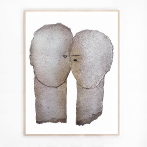 A maple wood framed high quality art print of a romantic abstract portrait of a love couple in shades of grey with silver finish on white. The two heads are composed of torn rough paper layers with exposed grungy edges and two eyes for accent.