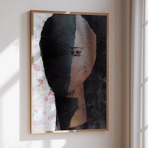 May include: Abstract painting of a face with a black and brown color scheme. The face is partially obscured by a black background. The painting is framed in a wooden frame.