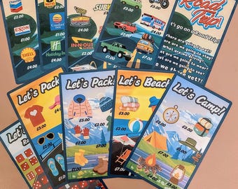 May include: A set of nine colorful game cards with a road trip theme. The cards feature various activities and items related to a road trip, such as packing, driving, eating, sleeping, camping, and going to the beach. Each card has a price listed on it, ranging from $1.00 to $7.00.