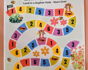Puede incluir: Un juego de mesa colorido titulado "Grow Your Savings" con un camino sinuoso de casillas numeradas. El juego presenta topillos, abejas y flores. Un dado amarillo descansa en la parte superior. El texto "Save with Judy and Alex" está en la parte inferior.