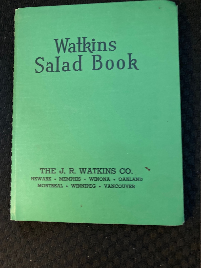 May include: A green book titled "Watkins Salad Book" with the publisher's information: "THE J. R. WATKINS CO. NEWARK MEMPHIS WINONA OAKLAND MONTREAL WINNIPEG VANCOUVER"
