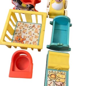 May include: A selection of vintage Fisher-Price Little People toys. Includes a yellow crib with a teddy bear and baby print, a red rocking horse, a yellow baby carriage, a blue rocking cradle, a red high chair, and a blue changing table.