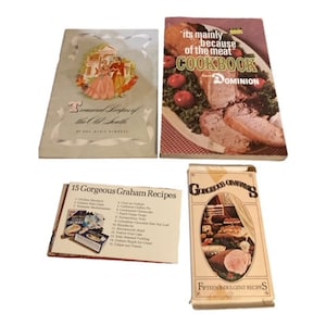 May include: Four vintage cookbooks with colorful covers. The cookbooks are titled "Treasures of the Old South", "It's Mainly Because of the Meat Cookbook", "15 Gorgeous Graham Recipes", and "Ginger Snaps Fifteen Indulgent Recipes".