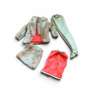 May include: A doll clothing set consisting of a beige faux fur jacket with a bright orange lining, a matching beige faux fur skirt, a sleeveless bright orange top with a metallic trim, and a pair of shimmering gold metallic leggings.