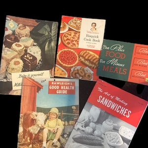 May include: A collection of vintage cookbooks, including "Bisquick Cook Book", "The Plus Food For Minus Meals", "Rawleigh's Good Health Guide", "The Art of Making Sandwiches", and "1955 Almanac & Cook Book".