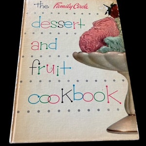 May include: The Family Circle dessert and fruit cookbook with a colorful cover featuring a bowl of ice cream and a strawberry.