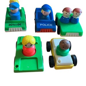 May include: A collection of colorful toy cars, including a green taxi, a blue police car, and other vehicles with small figures. The toys are made of plastic and feature bright colors and simple designs.