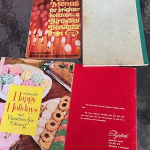 May include: A collection of vintage cookbooks and recipe booklets. One booklet features the text "Festive Menus for brighter holidays...a Birthday Bonanza from Kraft." Another reads "recipes for Happy Holidays and Goodies for Giving."