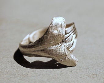 Imaginative silver ring with tail fin whale and sea waves