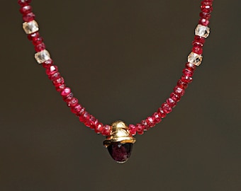 Red gemstone necklace with unique gold