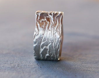 wide silver ring with wild structure