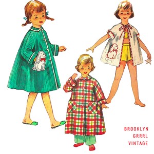 May include: Three girls wearing different styles of dresses. The girl on the left is wearing a green dress with a white rabbit toy. The girl in the middle is wearing a red and green plaid dress. The girl on the right is wearing a white dress with a yellow skirt and a white rabbit embroidered on the front. The text "BROOKLYN GRRRRL VINTAGE" is at the bottom of the image.