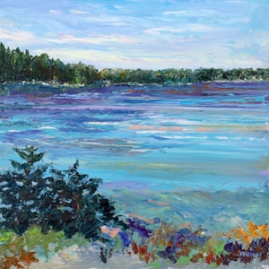 May include: An impressionistic painting of a lake scene. The water is a mix of blues and purples, with hints of orange and pink. A line of green trees sits on the horizon under a light blue sky. Foreground features a dark green bush and colorful foliage.