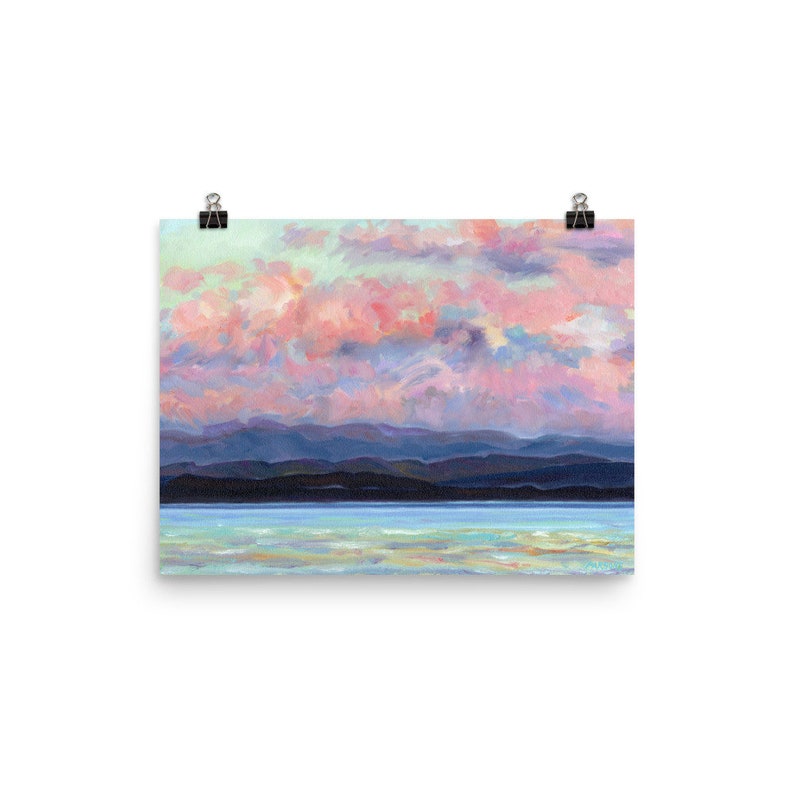 May include: A painting of a pink and purple sunset over a dark blue mountain range and a light blue body of water.