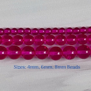 May include: Three rows of pink glass beads in sizes 4mm, 6mm, and 8mm. Sizes: 4mm, 6mm, 8mm Beads