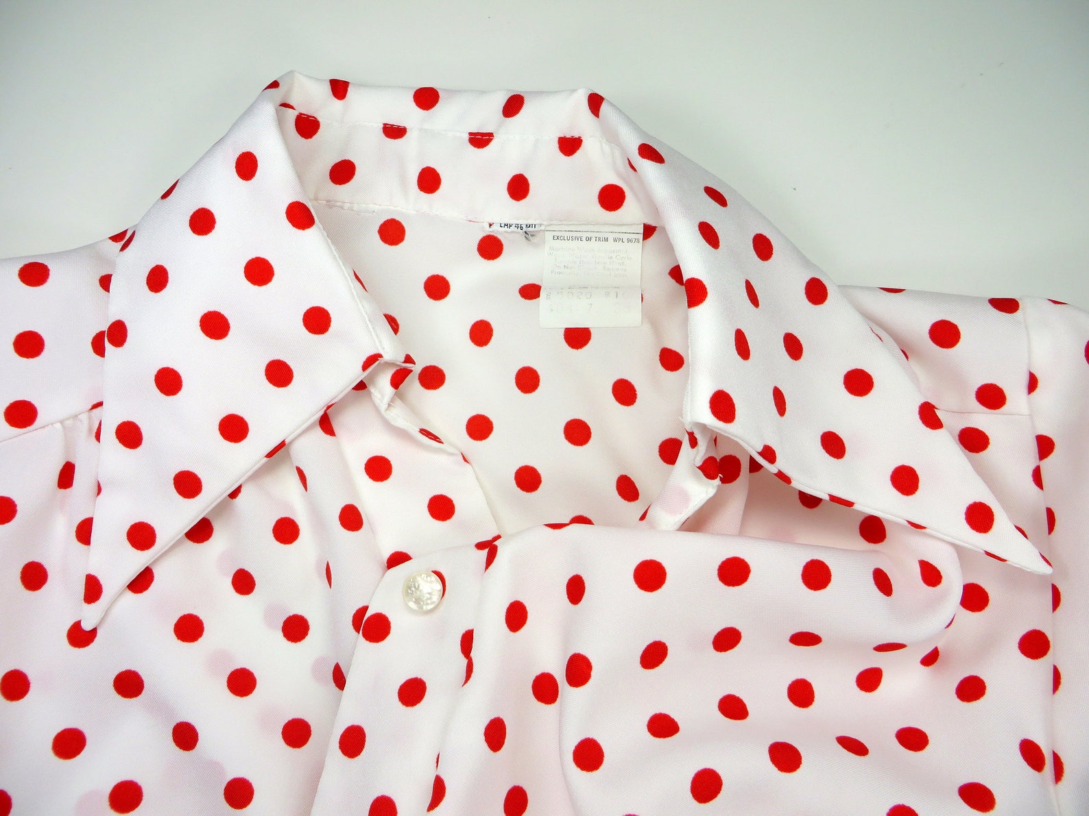 white red polka dot shirt