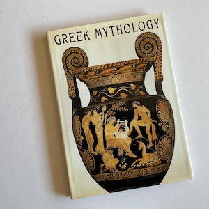 May include: A hardcover book titled "GREEK MYTHOLOGY" with a decorative illustration of a black and gold ancient vase. The vase features figures in yellow and black, with a white background.