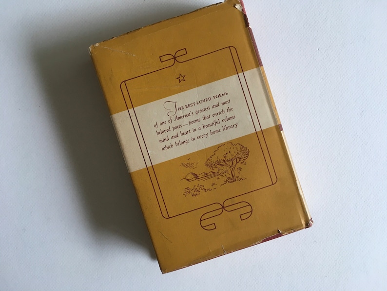 May include: The back cover of a yellow book with a brown border and a white label. The label has the text "THE BEST-LOVED POEMS of one of America's greatest and most beloved poets - poems that enrich the mind and heart in a beautiful volume which belongs in every home library." There is a small star above the word "THE" and a decorative design at the bottom of the label.