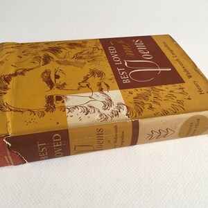 May include: A brown book with a gold cover featuring a black and white illustration of a man's face. The title of the book is "Best Loved Poems" by Henry Wadsworth Longfellow.
