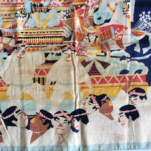 May include: A vintage Japanese fabric panel depicting a colourful procession. The panel features a group of people in white robes, a decorated float, and a figure in red and black armour. The background is a blue sky with white clouds.