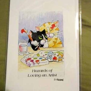 Biglietti d'auguri per gatti, interni vuoti, gatto artista smoking e gatto tigre, titolo: i rischi di amare un artista