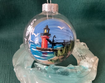 South Haven lighthouse  glass ornament about 3 “ hand painted with acrylic.