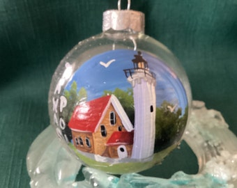 Tawas Lighthouse glass ornament hand painted with acrylics.  It is located on Lake Huron in Tawas State Park.