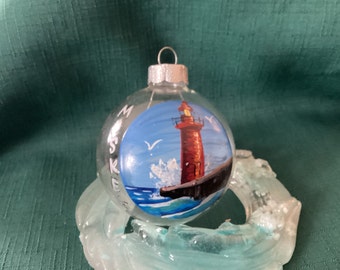 Muskegon lighthouse glass ornament hand painted with acrylic.