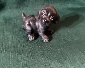Standing ceramic black Labrador puppy hand painted with acrylics.