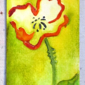 May include: A watercolour painting of a single red poppy flower with a white centre and green stem and leaf on a yellow-green background.