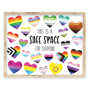 May include: A framed print with the text "This is a safe space for everyone" surrounded by watercolor hearts in various colors representing different pride flags.