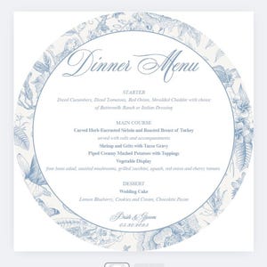 Puede incluir: Un menú de cena de boda redondo con un borde floral azul. El menú incluye entrantes, platos principales, una exhibición de verduras y postres. El texto dice "Dinner Menu" y "Pride & Groom 05.30.2095".