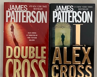 May include: Two paperback books by James Patterson featuring Alex Cross. The book on the left is titled "Double Cross" and has a red cover with gold lettering. The book on the right is titled "I, Alex Cross" and has a black cover with gold lettering. Both books have the text "#1 New York Times Bestseller" on the cover.
