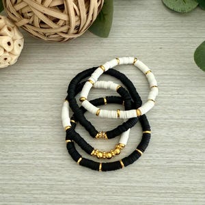 Effortless Elegance: Black, White & Gold Bracelet Stack
