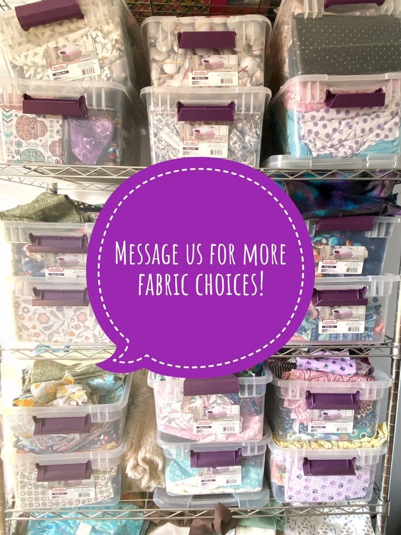 May include: Clear plastic storage bins filled with various fabrics, stacked on metal shelving. The bins have purple handles and labels. A purple speech bubble with white text reads "MESSAGE US FOR MORE FABRIC CHOICES!"
