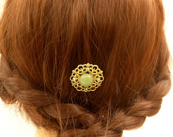 Small gemstone hair comb with jade cabochon, green and gold colored, festive hair accessory for parties, celebrations, and weddings.