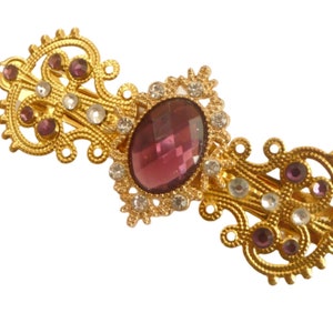 Exclusive unique hair clip with purple gemstone gold colored bridal wedding updo festive hair accessory