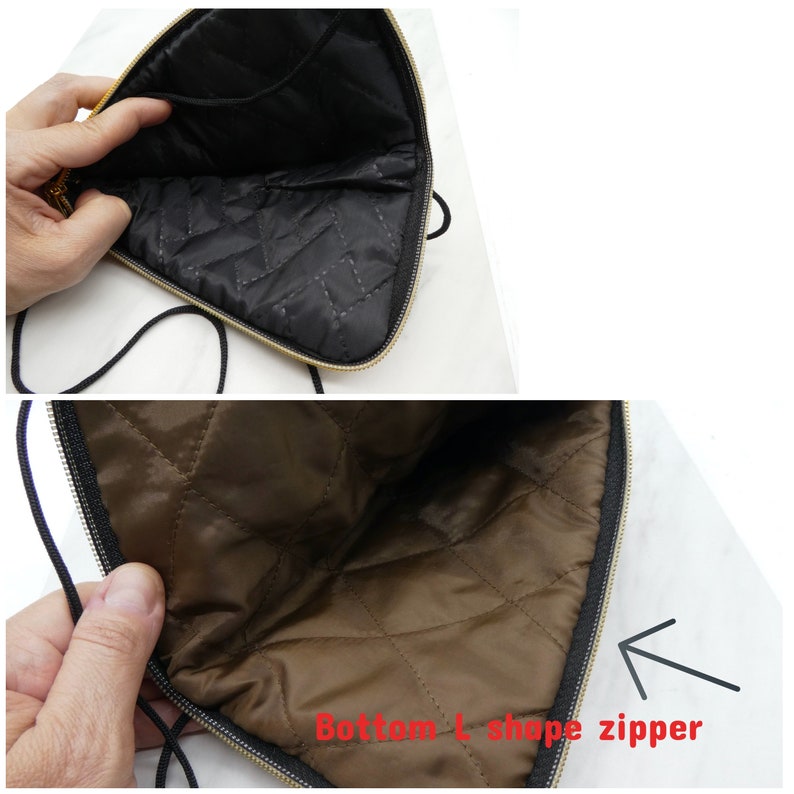 May include: A black quilted pouch with a gold zipper and a black drawstring closure. The zipper is shaped like an L at the bottom of the pouch.