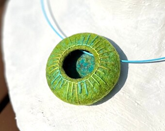 Pendant made of the finest merino wool with silk, finely embroidered, 5 cm wide, with steel cable 46 cm long