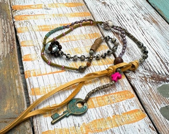 Delicate necklace made of glass beads - key - boho style - pendant 60 cm
