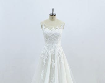 A line wedding dress Lace wedding dress with scoop neckline Gorgeous lace bridal gown